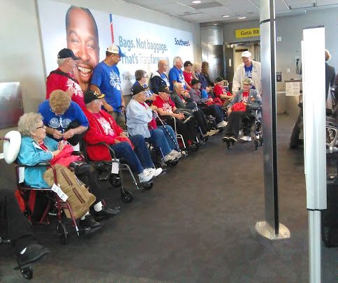 Honor Flight veterans from New York smile with appreciation for the warm reception they received at BWI. (Lisa Salkov)